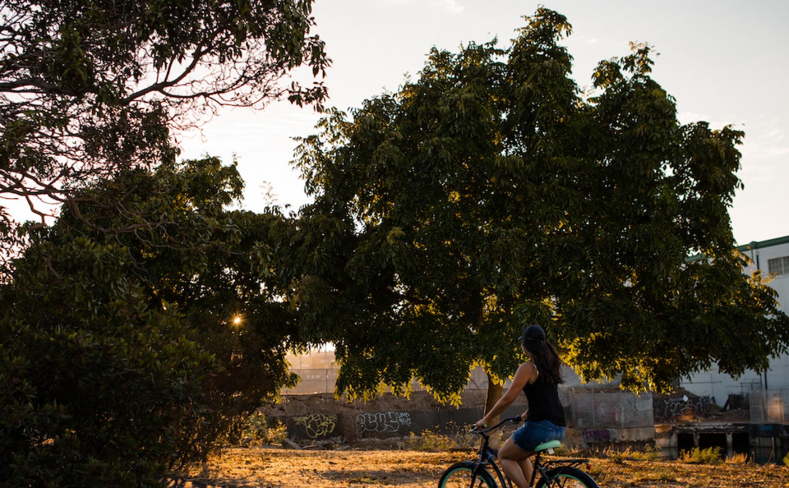 Woman biking at Warm Water Cove