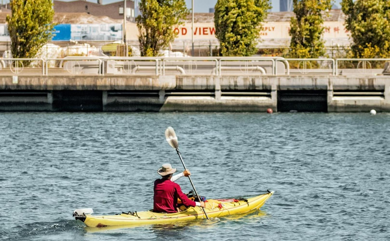 Kayaker paddles in Islais Creek