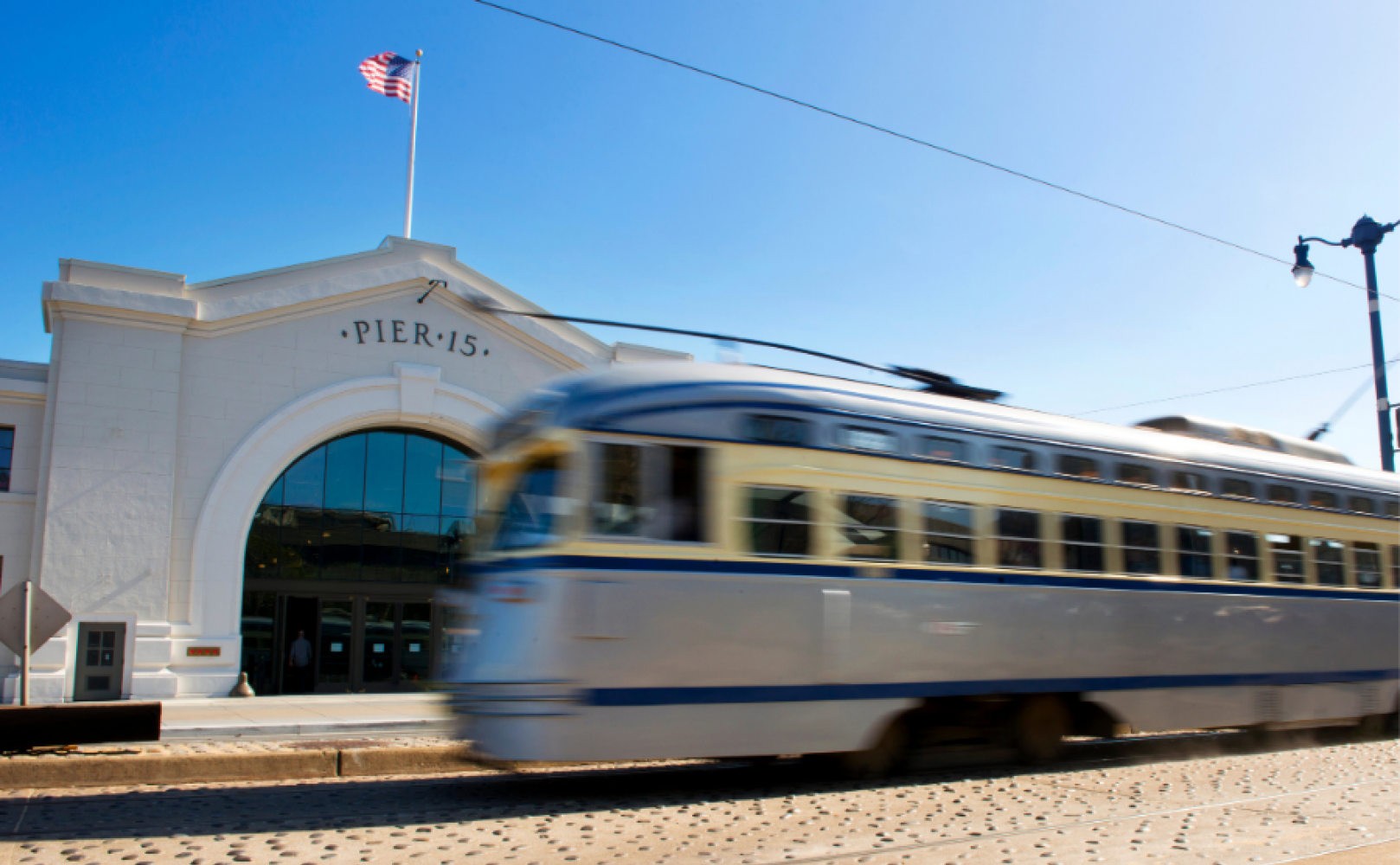 Streetcar zooms by Pier 15 in a blur