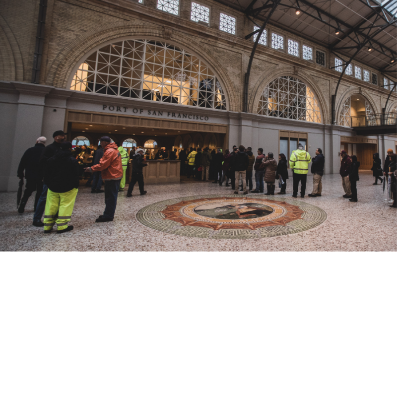 People line up outside a meeting room in the Ferry Building